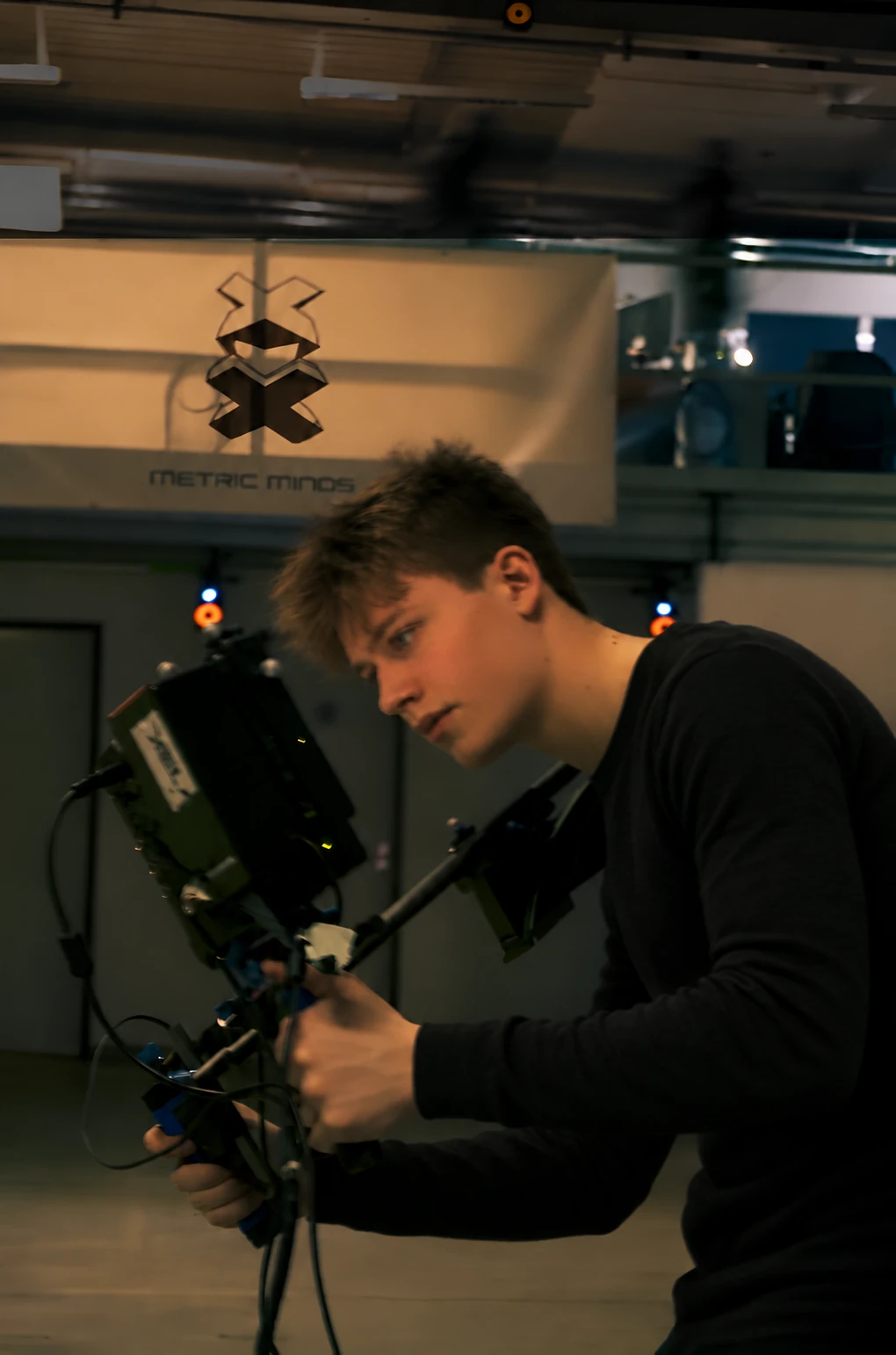 Joe Garth framing a shot with a virtual camera on a motion-capture stage, 2013
